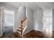 Bright entryway featuring hardwood floors and a staircase with wooden handrail at 3019 Havenwood Way, Stonecrest, GA 30038