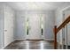 Inviting foyer with a decorative front door, beautiful flooring, and a classic chandelier at 3019 Havenwood Way, Stonecrest, GA 30038