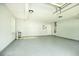 Spacious garage with sealed concrete floor and modern lighting at 3019 Havenwood Way, Stonecrest, GA 30038