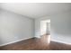 Open-concept living room boasting hardwood floors and freshly painted walls at 3019 Havenwood Way, Stonecrest, GA 30038