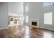 Inviting living room with a fireplace, hardwood floors, and views into the open kitchen at 3019 Havenwood Way, Stonecrest, GA 30038