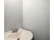 Simple powder room featuring a white pedestal sink and light blue paint at 3019 Havenwood Way, Stonecrest, GA 30038