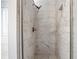 Bathroom with a standup shower with a mix of grey and white tile at 3019 Havenwood Way, Stonecrest, GA 30038