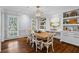 Elegant dining room with custom built-ins, stylish lighting, and hardwood floors perfect for entertaining at 3570 W Hampton Nw Dr, Marietta, GA 30064