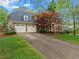 Beautiful brick home with attached garage and well-kept lawn, showcasing classic curb appeal at 3570 W Hampton Nw Dr, Marietta, GA 30064