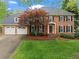Charming two-story brick home features a well-manicured lawn, attached two car garage, and mature trees at 3570 W Hampton Nw Dr, Marietta, GA 30064