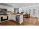 Bright kitchen with stainless steel appliances, granite counters, and a dining area with large windows at 3570 W Hampton Nw Dr, Marietta, GA 30064