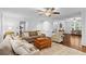 Spacious living room with a fireplace, custom millwork, and large windows at 3570 W Hampton Nw Dr, Marietta, GA 30064
