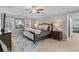 Serene primary bedroom with tray ceiling, plush carpet, and neutral tones promotes relaxation and comfort at 3570 W Hampton Nw Dr, Marietta, GA 30064