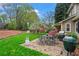 Outdoor patio area with grill, dining table and backyard views at 3570 W Hampton Nw Dr, Marietta, GA 30064