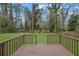 Expansive backyard view from a wooden deck overlooking a lush green lawn and mature trees at 3983 E Hilda Cir, Decatur, GA 30035