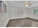 Bright bedroom with hardwood floors and large windows bringing in natural light at 3983 E Hilda Cir, Decatur, GA 30035