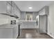 Well-lit kitchen featuring gray cabinets, modern appliances, granite countertops, and a stainless steel refrigerator at 3983 E Hilda Cir, Decatur, GA 30035