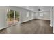 Spacious living room with new flooring and sliding glass doors leading to a deck, perfect for indoor-outdoor living at 3983 E Hilda Cir, Decatur, GA 30035