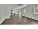 Open-concept living room featuring hardwood flooring, and direct access to the backyard at 3983 E Hilda Cir, Decatur, GA 30035