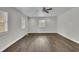 Bright living room showcasing hardwood flooring and a modern ceiling fan at 3983 E Hilda Cir, Decatur, GA 30035