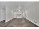 Spacious living room with beautiful flooring, a white brick fireplace, and plenty of natural light at 3983 E Hilda Cir, Decatur, GA 30035