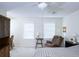 Comfortable bedroom with a ceiling fan, two windows and built-in shelving at 746 Oak Terrace Ter, Norcross, GA 30071