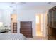 Bedroom featuring a large dresser, closet and an ensuite bathroom at 746 Oak Terrace Ter, Norcross, GA 30071