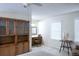 Cozy bedroom featuring a ceiling fan, built-in shelving and two windows at 746 Oak Terrace Ter, Norcross, GA 30071