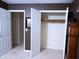 Bedroom featuring a closet with double doors, neutral paint, and carpet flooring at 746 Oak Terrace Ter, Norcross, GA 30071