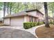 Two-car garage and landscaped walkway enhance this home's exterior at 746 Oak Terrace Ter, Norcross, GA 30071