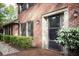 Exterior brick detail of home showing the covered entry and landscaping at 746 Oak Terrace Ter, Norcross, GA 30071