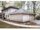 Exterior of home showing a two-car garage and backyard at 746 Oak Terrace Ter, Norcross, GA 30071
