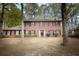 Traditional brick home with well-manicured front yard and mature trees at 746 Oak Terrace Ter, Norcross, GA 30071