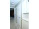 Hallway featuring neutral carpet, white doors, and access to the kitchen at 746 Oak Terrace Ter, Norcross, GA 30071