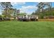 Sprawling backyard with a well-kept lawn and a charming home featuring a spacious deck at 756 Butler Ct, Lawrenceville, GA 30044