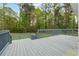 Expansive wooden deck featuring railings and stairs, ideal for outdoor entertaining and relaxation at 756 Butler Ct, Lawrenceville, GA 30044