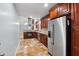 Open kitchen featuring stainless steel appliances, custom cabinets, and a stone tile floor, perfect for culinary enthusiasts at 756 Butler Ct, Lawrenceville, GA 30044