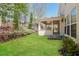 A cozy covered patio overlooks a green backyard and landscaping at 2168 Sugar Maple Nw Cv, Acworth, GA 30101