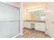 Bathroom features a large vanity with granite counters, framed glass shower and ceramic tile flooring at 2168 Sugar Maple Nw Cv, Acworth, GA 30101