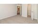 Bedroom featuring neutral walls, plush carpeting, and an open closet flowing into the bathroom at 2168 Sugar Maple Nw Cv, Acworth, GA 30101