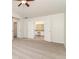 Spacious main bedroom with carpet, a ceiling fan, and a view into the bathroom at 2168 Sugar Maple Nw Cv, Acworth, GA 30101