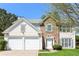 Charming two-story home with a well-manicured lawn and two car garage at 2168 Sugar Maple Nw Cv, Acworth, GA 30101