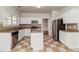 Spacious kitchen with island, tile flooring, granite countertops, and modern appliances at 2168 Sugar Maple Nw Cv, Acworth, GA 30101