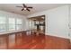 Bright living room with hardwood floors opens to the kitchen at 2168 Sugar Maple Nw Cv, Acworth, GA 30101