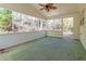 Covered porch with a ceiling fan offering a peaceful view of nature at 2168 Sugar Maple Nw Cv, Acworth, GA 30101