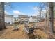 Backyard fire pit area with Adirondack chairs and string lights at 234 Fieldbrook Xing, Canton, GA 30115