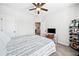 The bedroom features a ceiling fan, neutral paint and carpet, and bright natural light at 234 Fieldbrook Xing, Canton, GA 30115