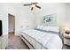 Neutral bedroom with a blue accent and view into the hallway at 234 Fieldbrook Xing, Canton, GA 30115