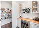 Butler's pantry with wine cooler and shelving at 234 Fieldbrook Xing, Canton, GA 30115