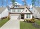 Beautiful two-story home showcasing a manicured front yard and a charming facade with a covered entryway at 234 Fieldbrook Xing, Canton, GA 30115