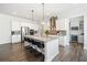 Open kitchen with island, stainless appliances, and bar stool seating at 234 Fieldbrook Xing, Canton, GA 30115