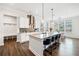 Gourmet kitchen featuring an expansive island with seating and modern light fixtures at 234 Fieldbrook Xing, Canton, GA 30115