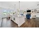 Spacious kitchen with large island overlooking living room and fireplace at 234 Fieldbrook Xing, Canton, GA 30115