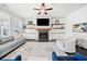 Open living room with a fireplace, built-in shelves, and lots of natural light at 234 Fieldbrook Xing, Canton, GA 30115